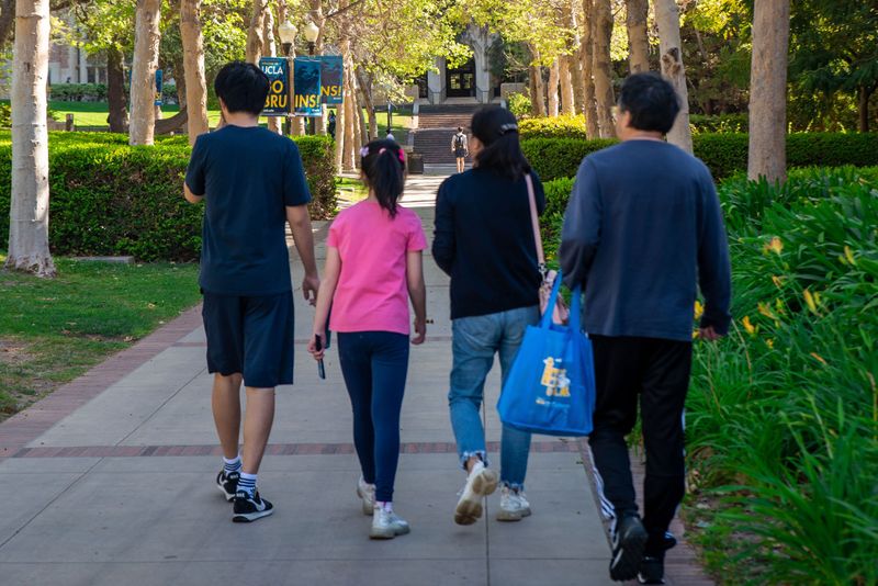 A family of four touring the UCLA campus
