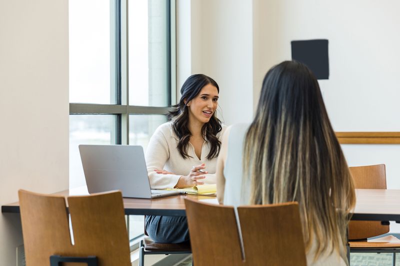 Students collaborating at a study room table