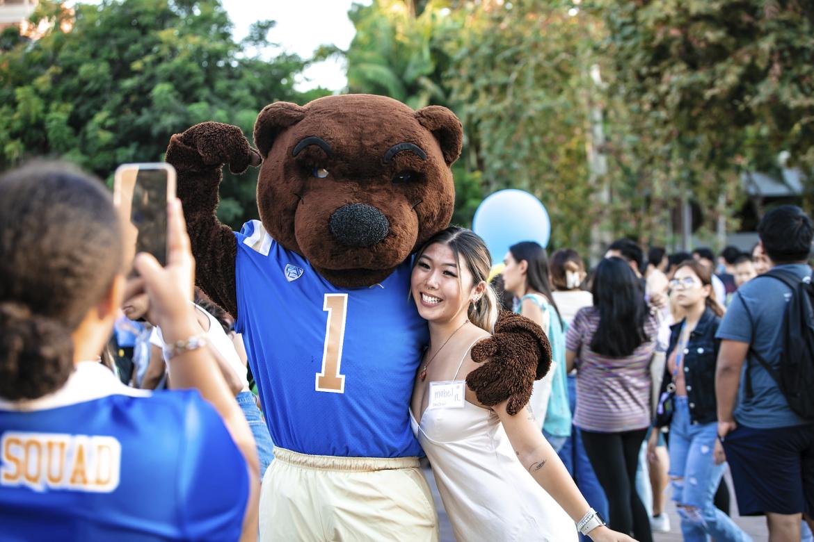 UCLA student posing with Joe Bruin