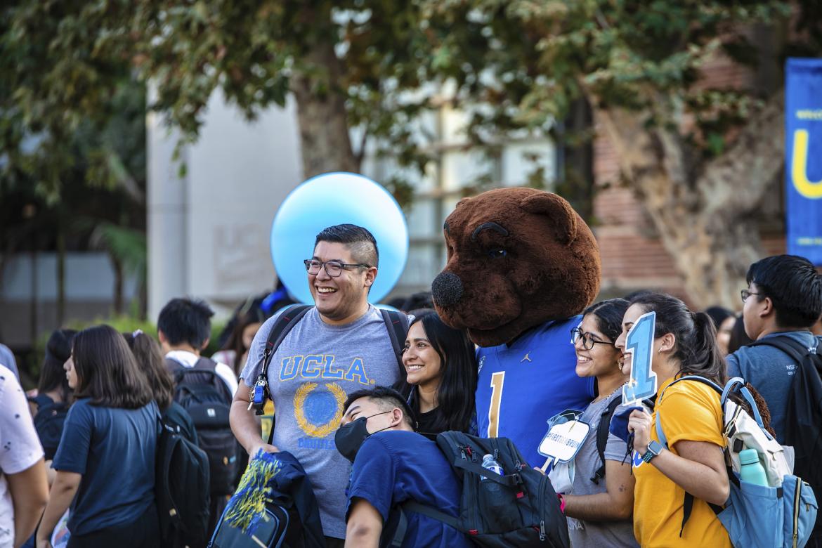 UCLA students taking a picture with Joe Bruin