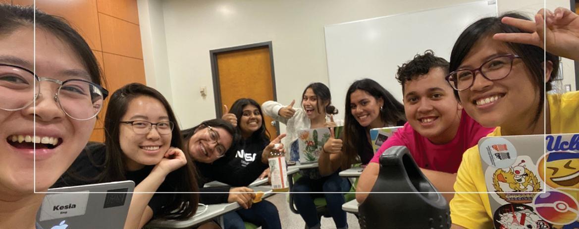 Image of students smiling and posing for the camera