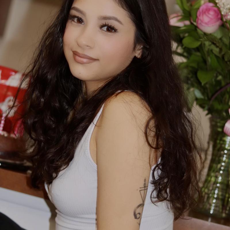 Image of Adriana SanMiguel smiling and posing